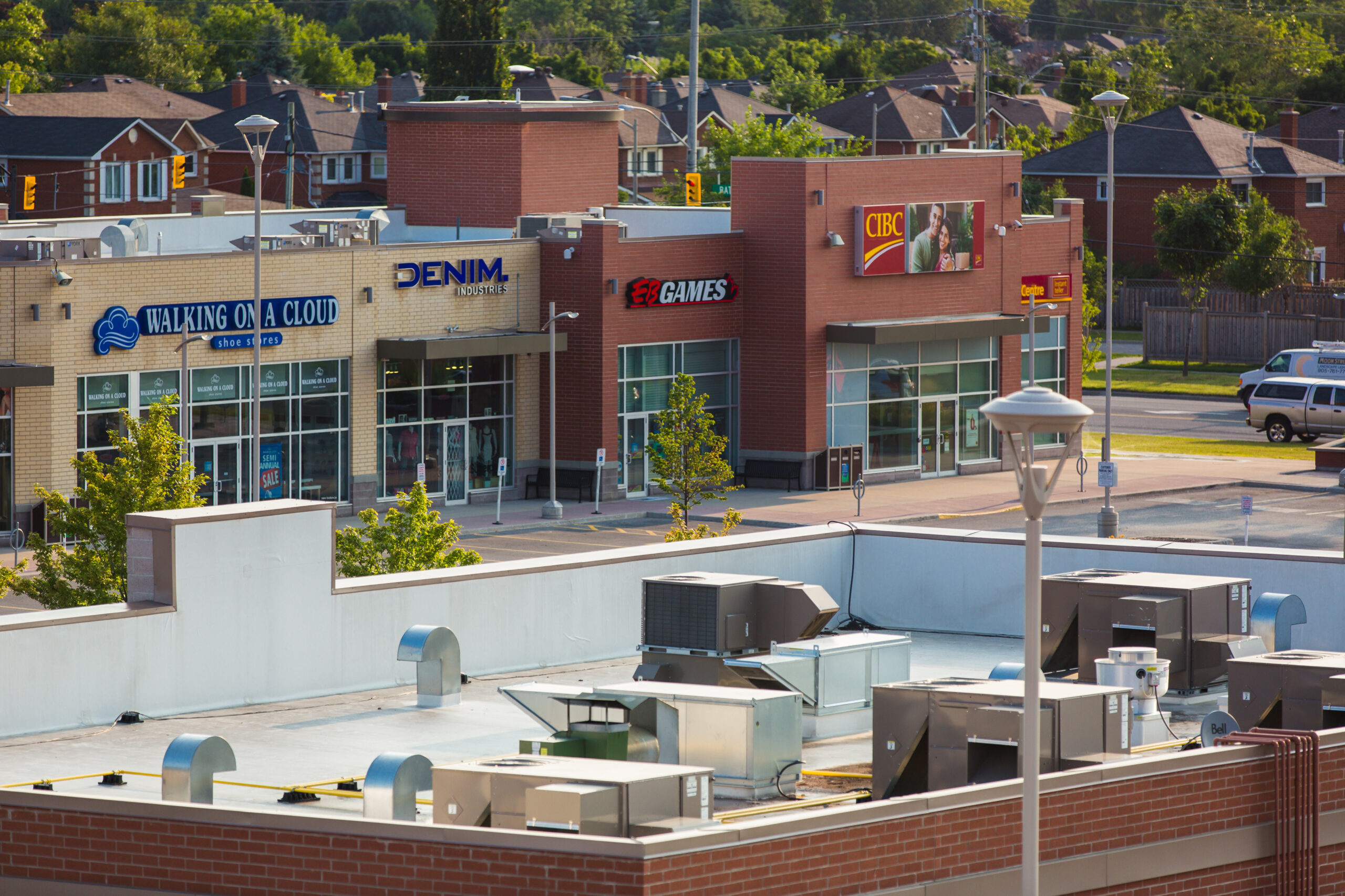 Rooftop view of retail buildings at Rutherford Market Place showing mechanical equipment and surrounding streetscape.