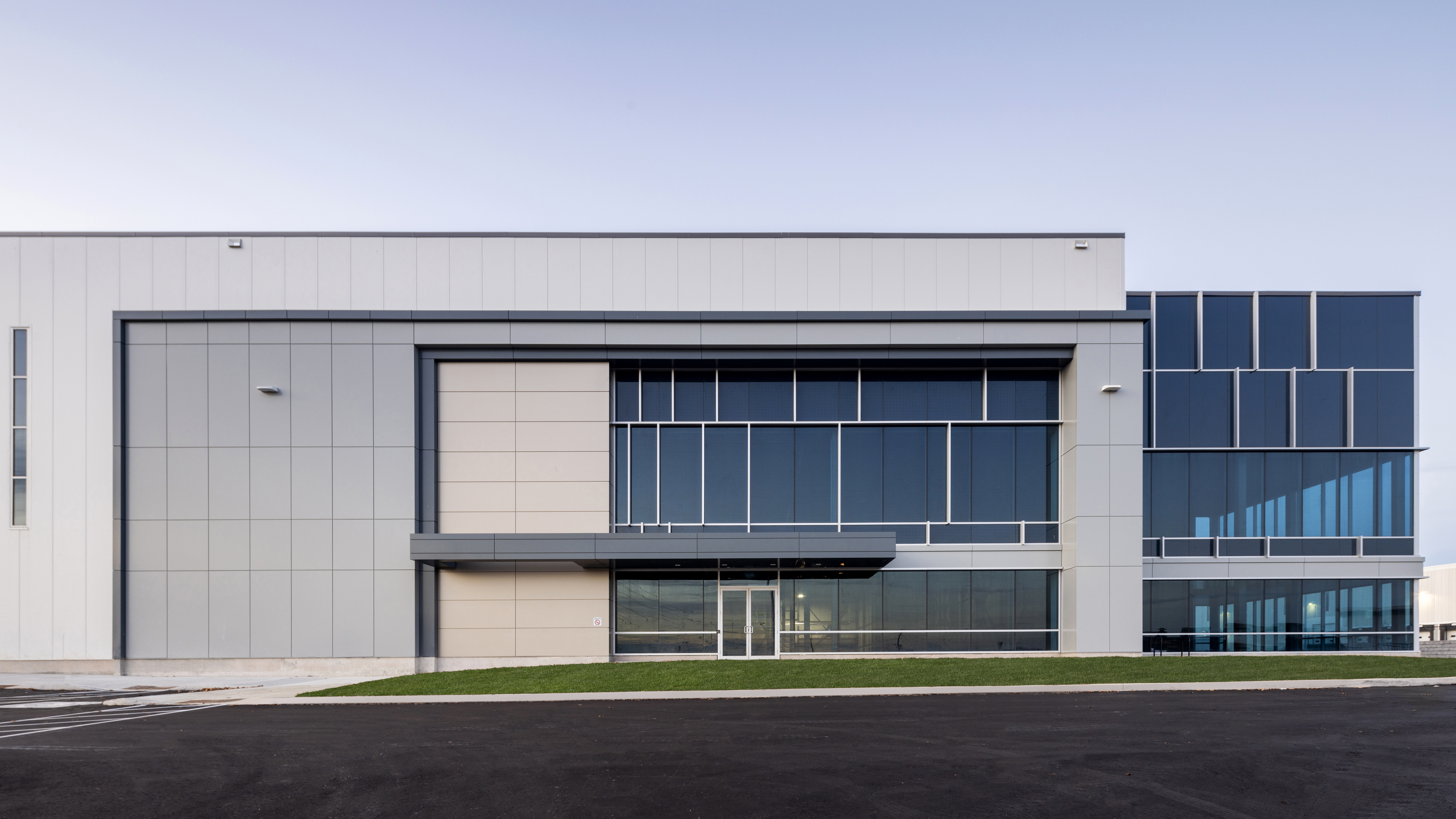 Front exterior view of the building at 6525 Mississauga Road North showing the main office entrance and industrial structure.