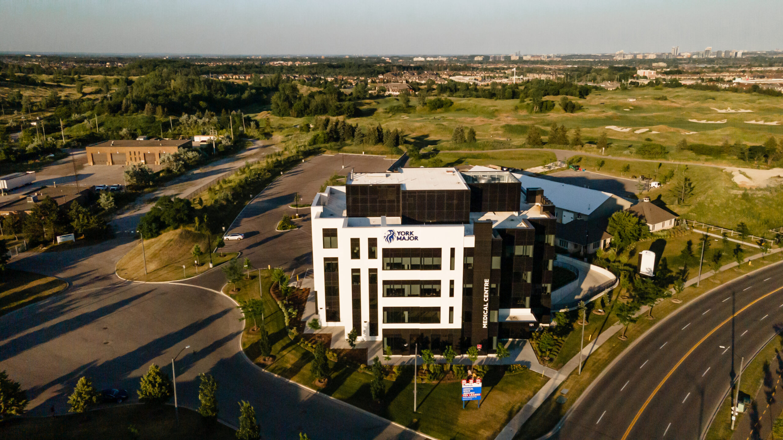 Aerial view of York Major Medical Centre showing the multi-storey medical building, surrounding roads, and landscaped grounds.