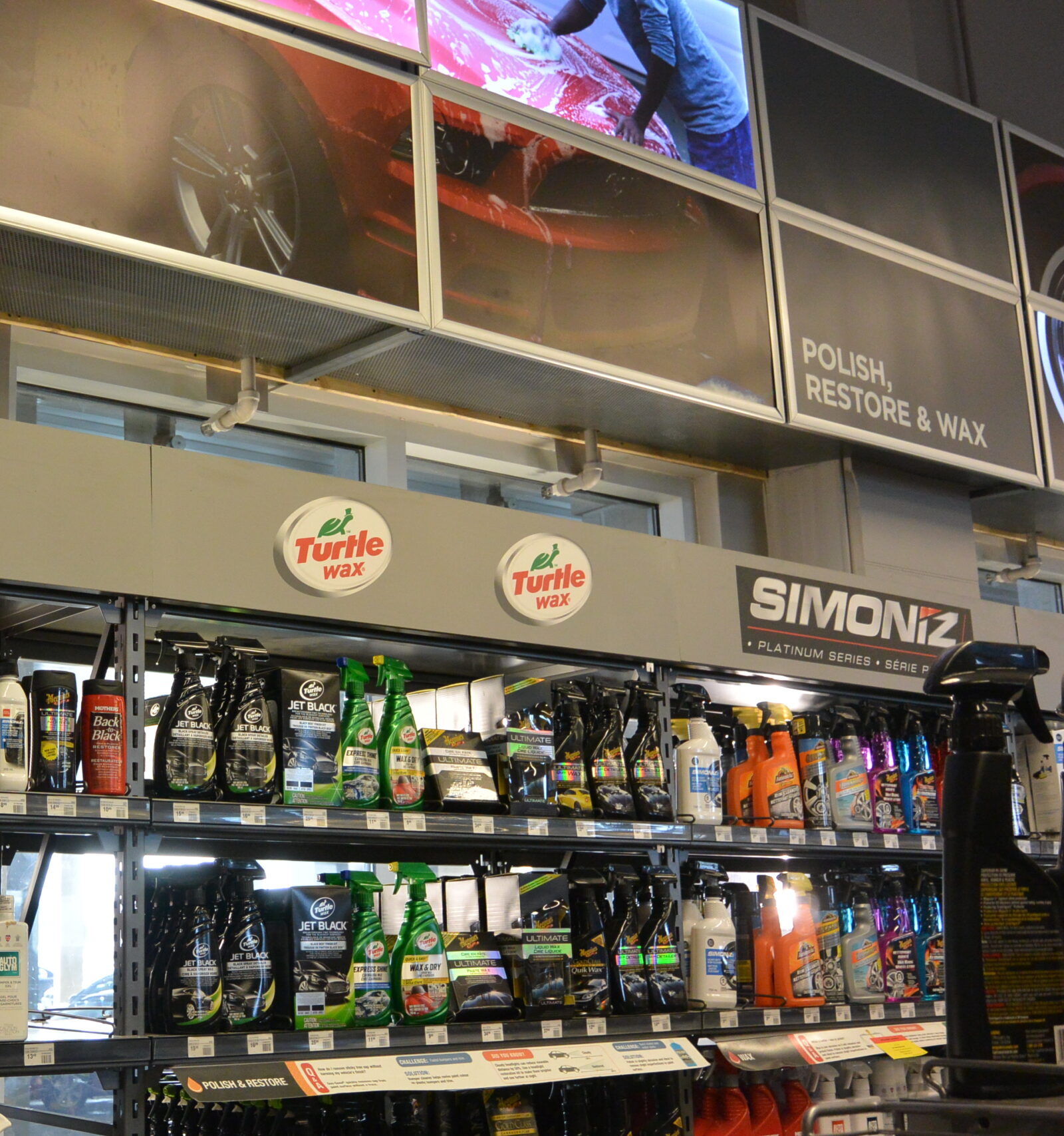 Automotive products shelf inside a Canadian Tire store displaying car care and maintenance items.